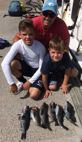 With only one day remaining in the summer sea bass season the Thomas boys fished with us today on a 6 hour trip.  We started on wrecks at 50' to 60' and caught 6" to 8" sea bass, moved to 75" to 90' wrecks and caught 10" to 12" sea bass.  Finally found keeper size sea bass on the 110' deep wrecks.  Not monsters, but over 12.5".  The largest was about 15.5". We caught over 60 sea bass, and did finally get our three man limit. We also caught sea robins, fluke (no keepers), bergal, and a bullet mackerel pictured. Fin 7 and Ian 12 had a great time, and are really good fisherman.  It was Fins first ocean trip.  Both boys landed several doubleheaders. The Riptide B&T salt clam and the cut squid from tubes worked great.