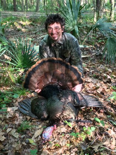 Brad Berkheimer is all smiles over his first gobbler-16#, 10.5" beard, 7/8" spurs.  What a morning!  He dropped the turkey at 14 steps!