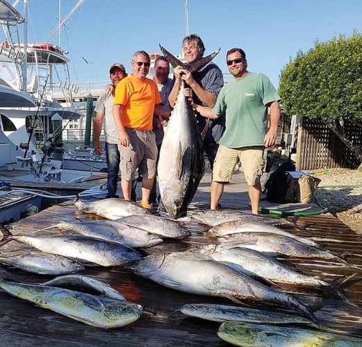 Fishing Report - Carly A Sportfishing out of OBX got a few. The angler holding the bigeye is 6'8"! It tipped the scales at 214. #fishing #obx #CarlyA #bigeye #tuna #finandfield