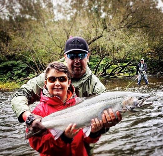 Happy young angler is making memories with Douglaston Salmon Run. #Fishing #Adventure #NY #FinandField