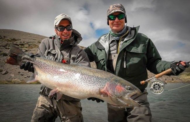 If you liked Alena Kirillova’s rainbow from yesterday, check out this one caught by her husband, Oleg Veber (right) on the same trip to Patagonia’s Kooi Noom Lodge. http://bit.ly/1A6nOEp #simmsfishing #forgettheforecast