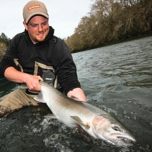 Ian winder of Bigfoot Fishing with a beautiful slab of cold steel from the Olympic peninsula. #simmsfishing #forgettheforecast