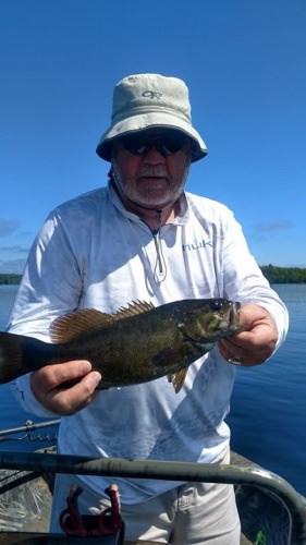 Mike Shelby with one of the small note bass he caught.