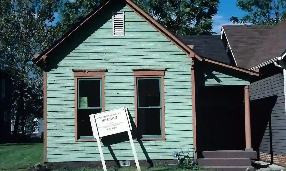 Green-painted historic home for sale in Indianapolis amid 2025 U.S. housing market conditions