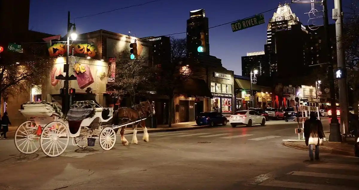 Street scene in downtown Austin, showing historic low-rise buildings and pedestrians