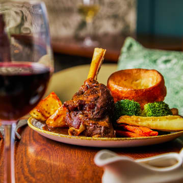 Traditional Sunday Roast with a Glass of Wine for Two
