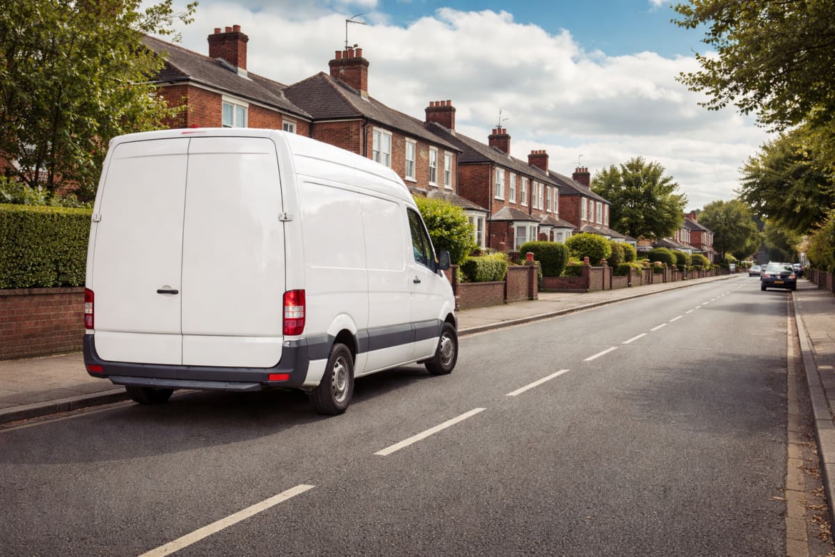 Removal van with boxes and protected furniture ready for transport