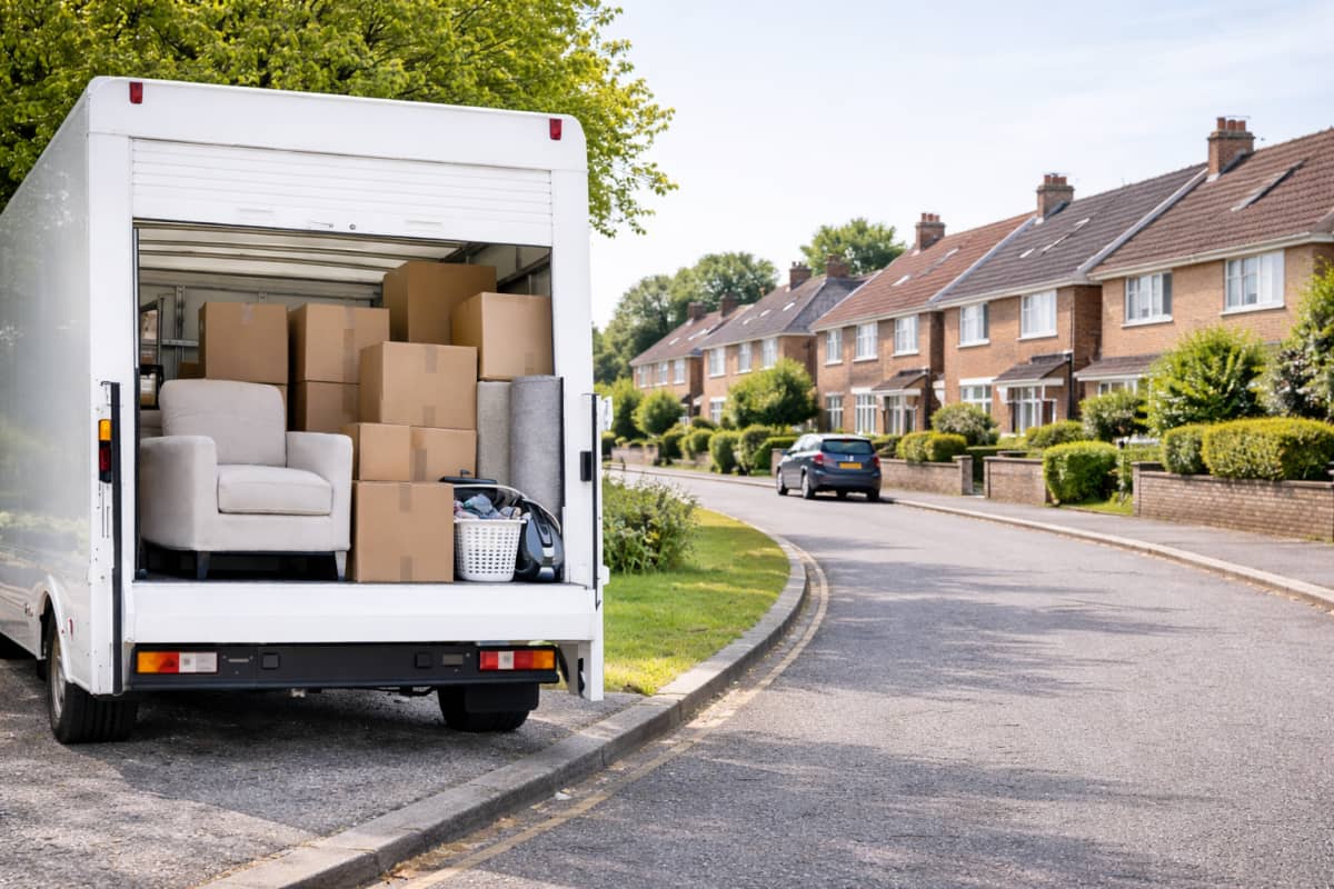 Removal van with boxes and protected furniture ready for transport