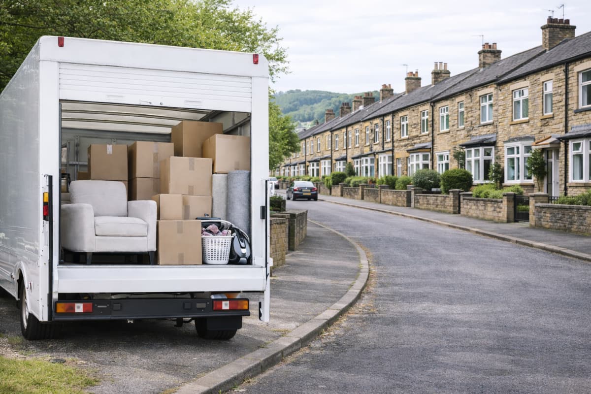 Removal van with boxes and protected furniture ready for transport