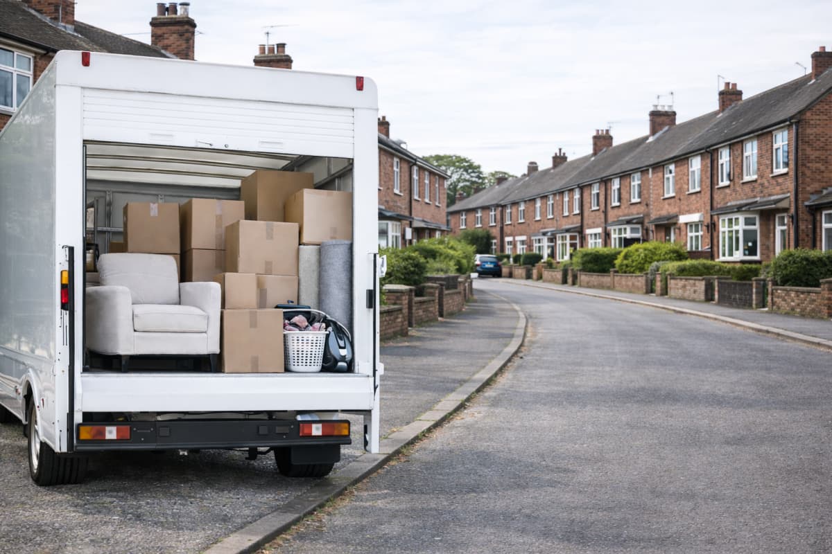 Removal van with boxes and protected furniture ready for transport