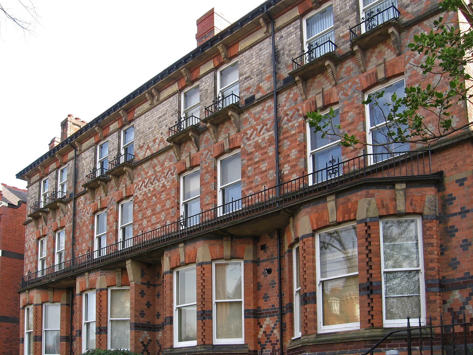 Historic house with polychromatic brickwork on University Road, Leicester, near the University of Leicester campus.