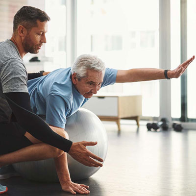 Occupational therapist helping an old man