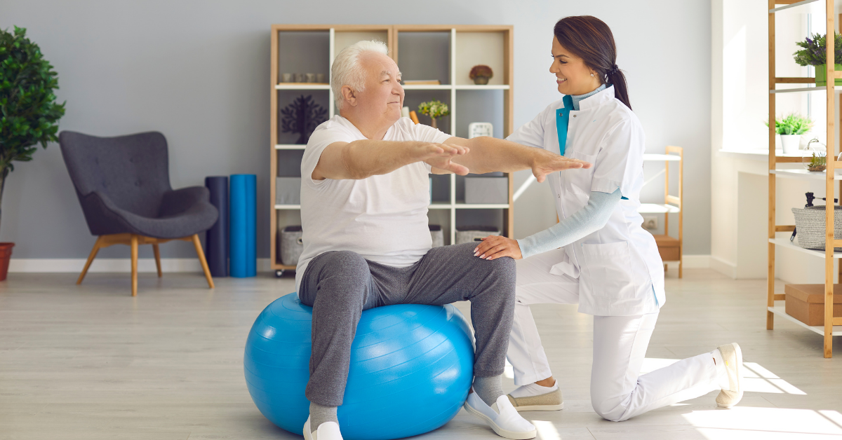 A female physical therapy professional treating an old man