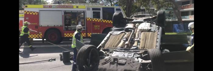 An image relating to the news item Flipped car during peak hour