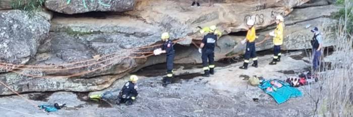 An image relating to the news item Firefighter lowered to rescue man trapped on ledge above Mermaid Pool - Video