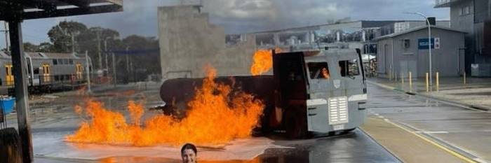 An image relating to the news item Sydney Swans AFLW star kicking goals with Fire and Rescue NSW