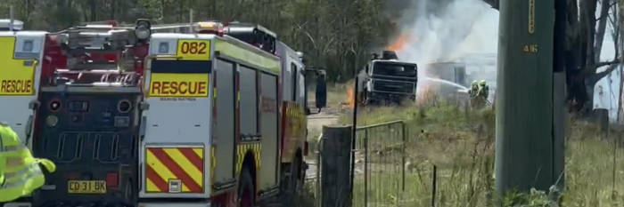 An image relating to the news item Fire and Rescue NSW firefighters extinguish grass fire burning close to homes 