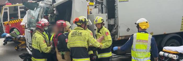 An image relating to the news item Firefighters free trapped pair after truck hits building 