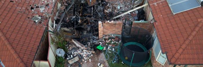 An image relating to the news item Fire and Rescue NSW investigators return to scene of garage explosion to determine cause 