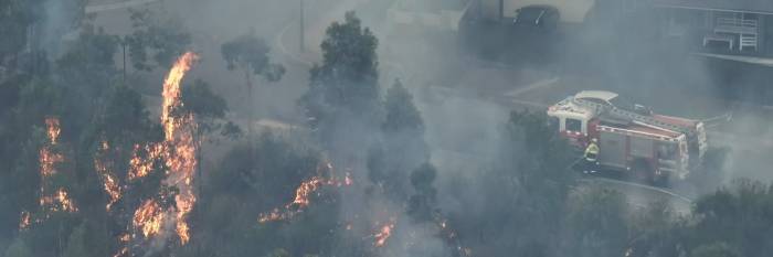 An image relating to the news item Firefighters carry out hazard reduction burn to protect homes 