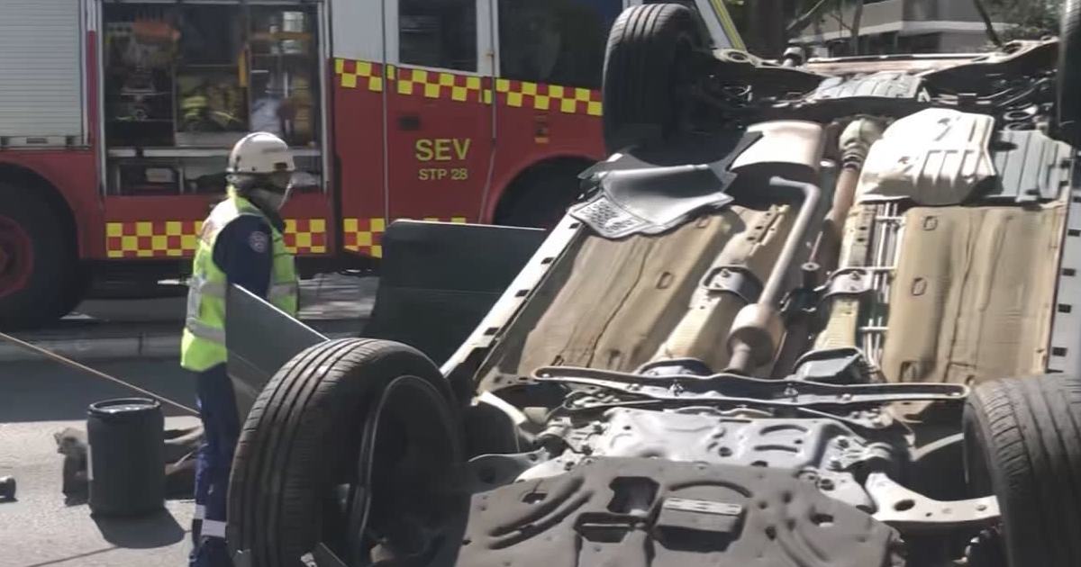 An image relating to the news item Flipped car during peak hour