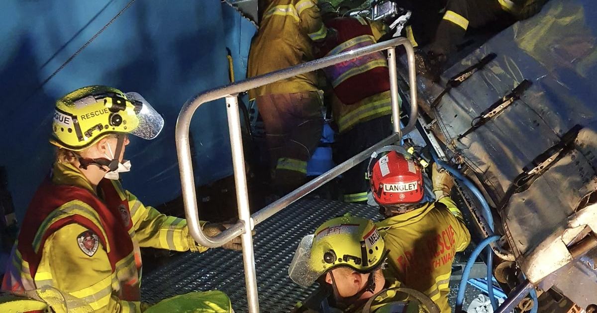 An image relating to the news item Driver rescued from three-truck crash