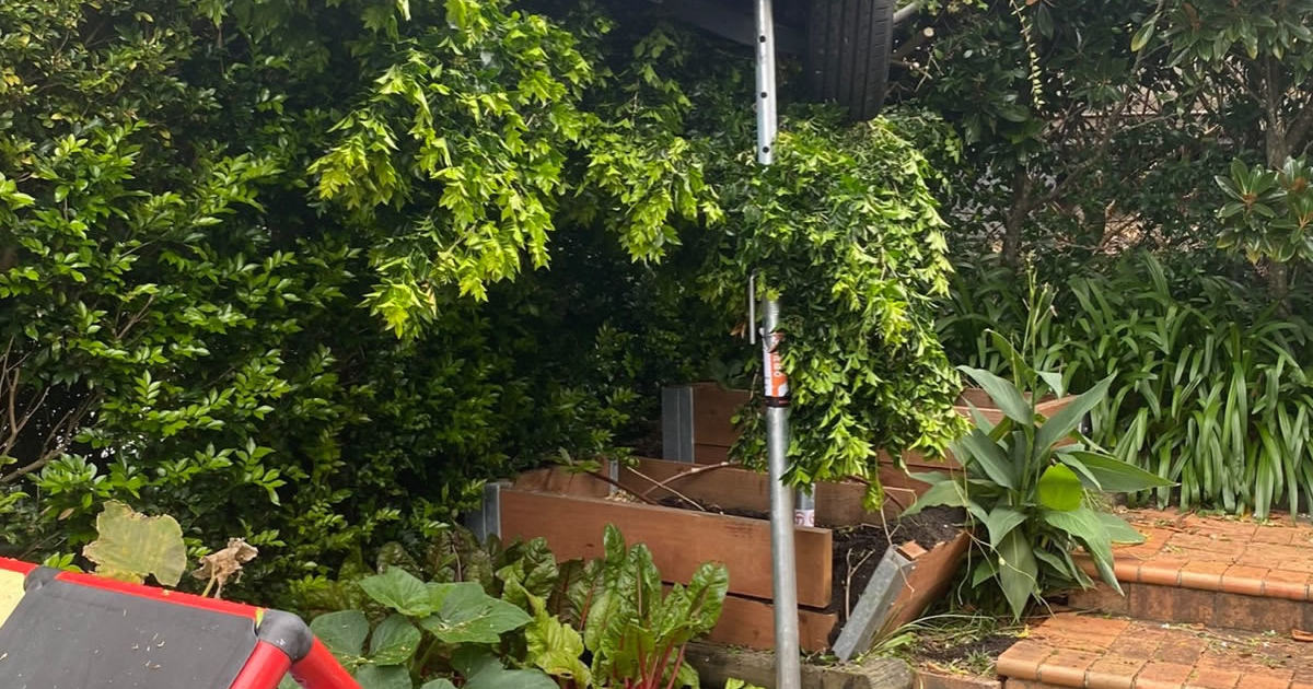 An image relating to the news item Woman rescued - car caught in fence
