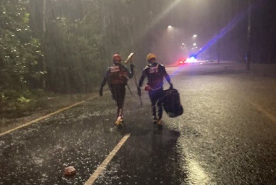 An image relating to the news item Firefighters save family of five including pregnant mum from floodwaters