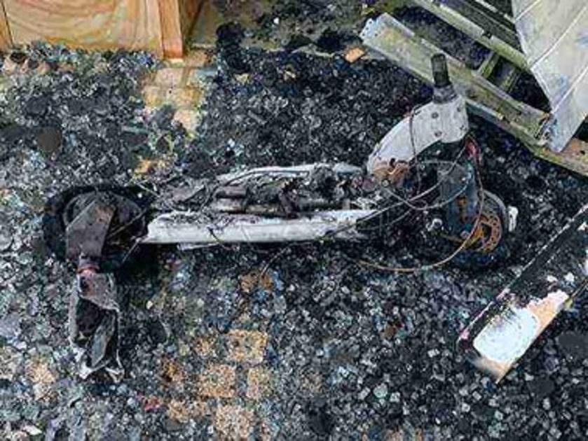 An image relating to the news item E-scooter catches fire, destroying garage and luxury car