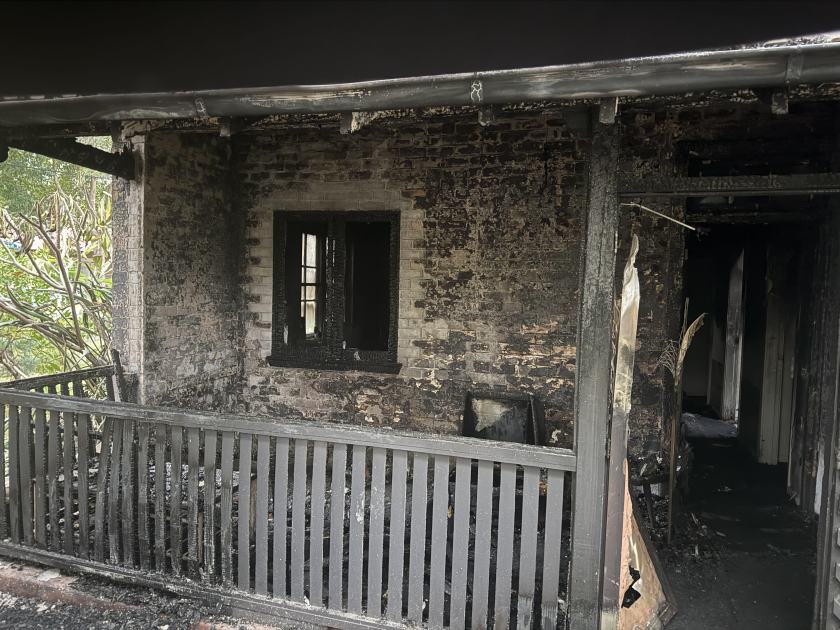 An image relating to the news item Firefighters rescue collapsed woman from burning home