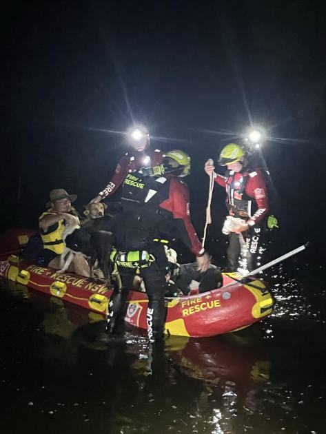 An image relating to the news item Details of extraordinary flood water rescue – Trapped couple and their working dogs towed to safety on makeshift raft