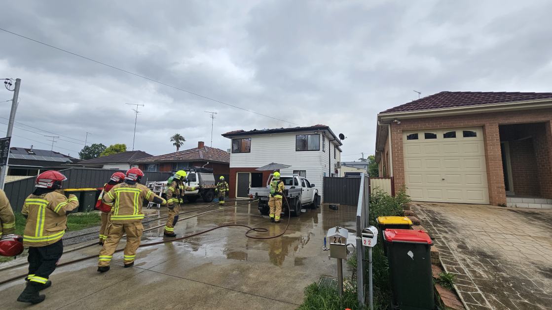 An image relating to the news item Two people evacuate home with roof on fire