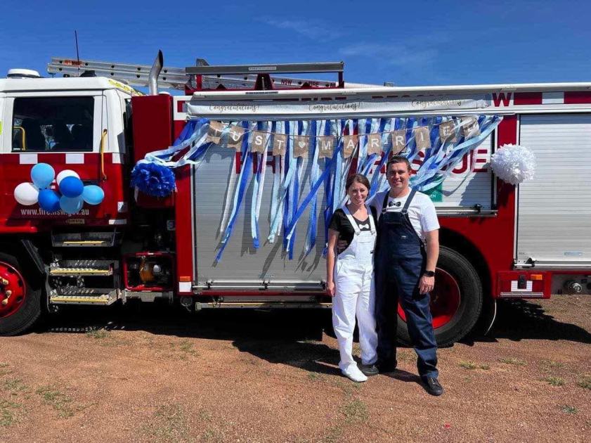 An image relating to the news item Fire and Rescue NSW newlyweds stop by fire station for happy snaps after exchanging vows