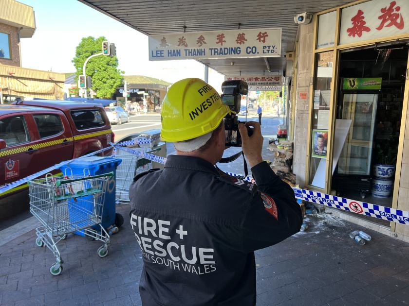 An image relating to the news item Fire investigators examine scene of grocery store blaze - UPDATED