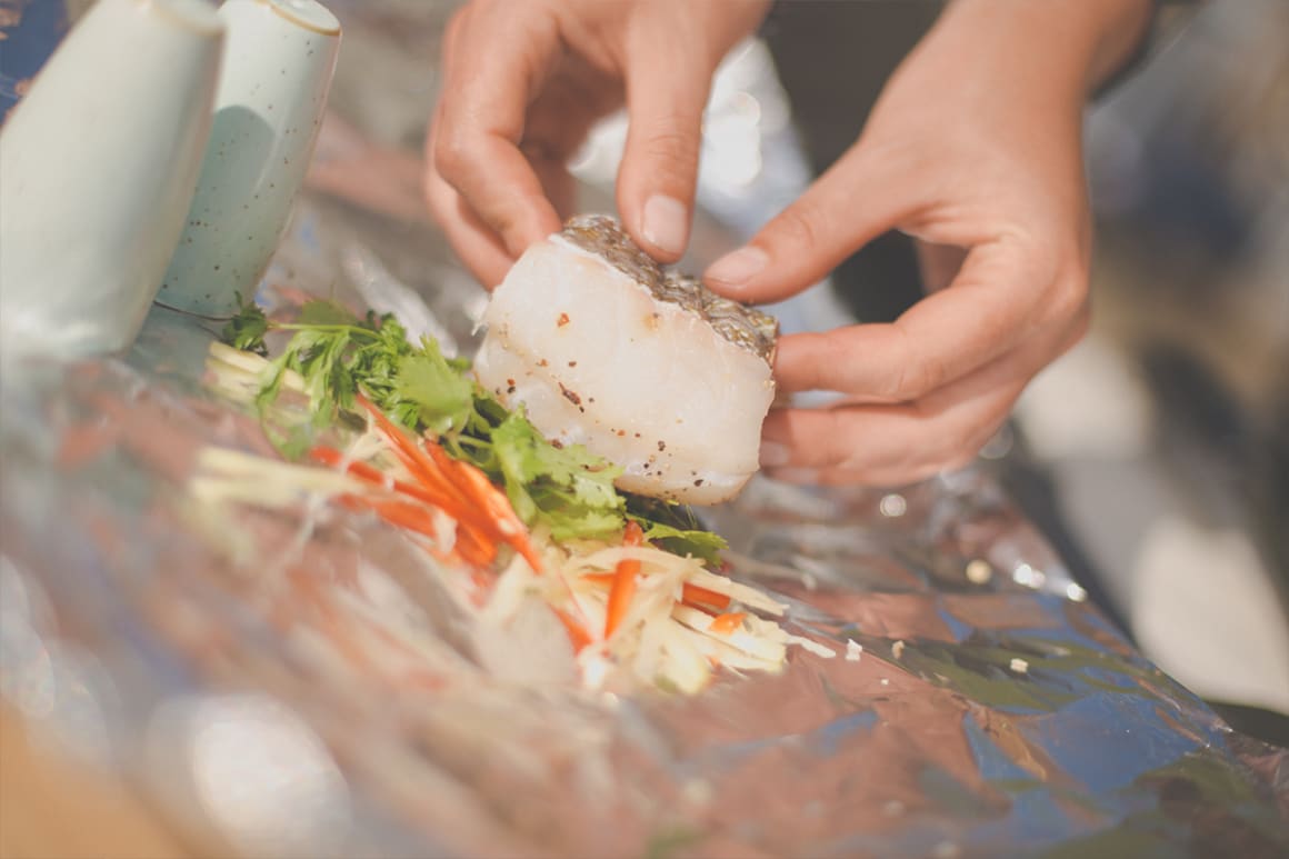 Cook fish in foil parcels on the barbecue