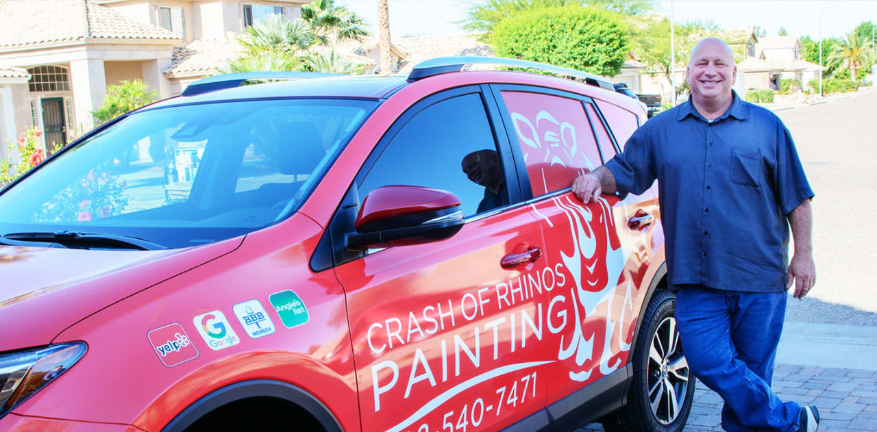 Our owner, Mike Ricker, poses next to one of our vehicles, which carries our inspection team from project-to-project.