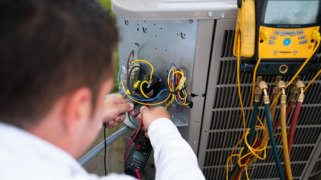 An Allbritten technician runs several tests, including an electrical test, to ensure this air conditioner is functioning safely.
