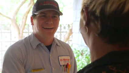 Our AC repair tech greets this local homeowner at the door before inspecting the home's air conditioner.