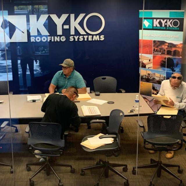The KY-KO Roofing team meets to go over an upcoming roofing project here in Phoenix, Arizona.