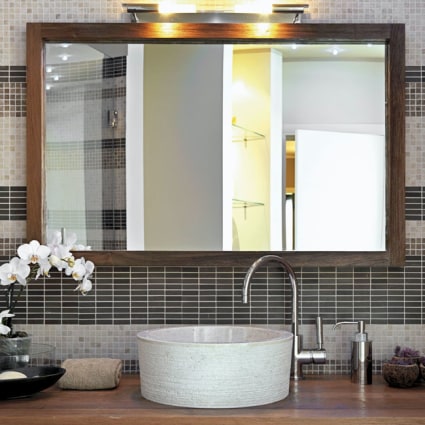 Remodeling your bathroom? Give us a call and have us install a stylish new mirror, like the one seen here.