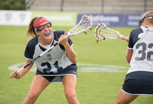 USA's taylor Cummings runs towards Welsh traffic at the 2017 FIL Rathbones Women's Lacrosse World Cup, at Surrey Sports Park, Guildford, Surrey, UK, 18th July 2017.