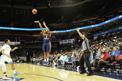 DePina shooting a three during his senior season at Lincoln.