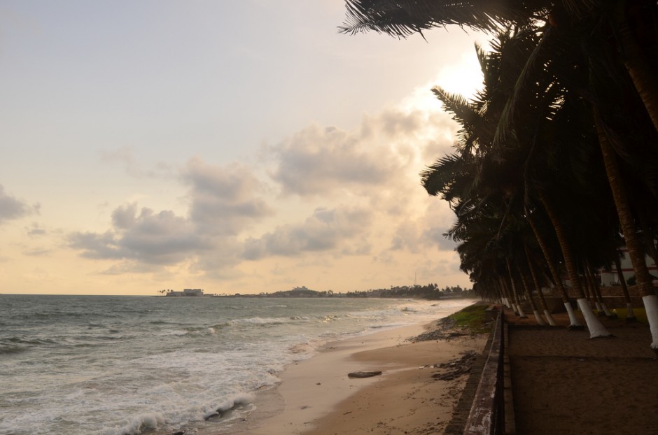 Quiet coastal scenery with soft waves and golden light.
