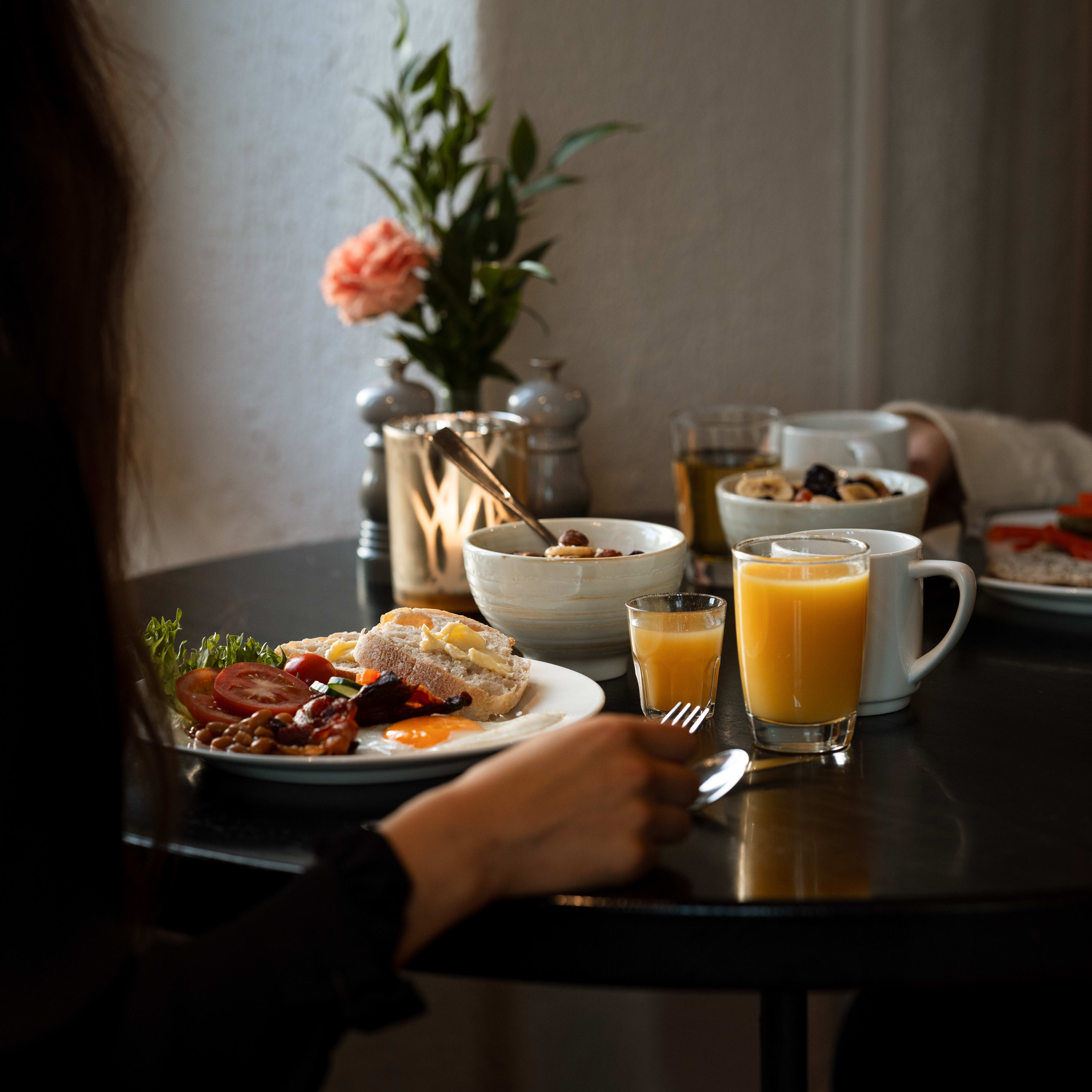 Cozy breakfast atmosphere at Clarion Hotel Admiral Bergen featuring harbor views and traditional dishes
