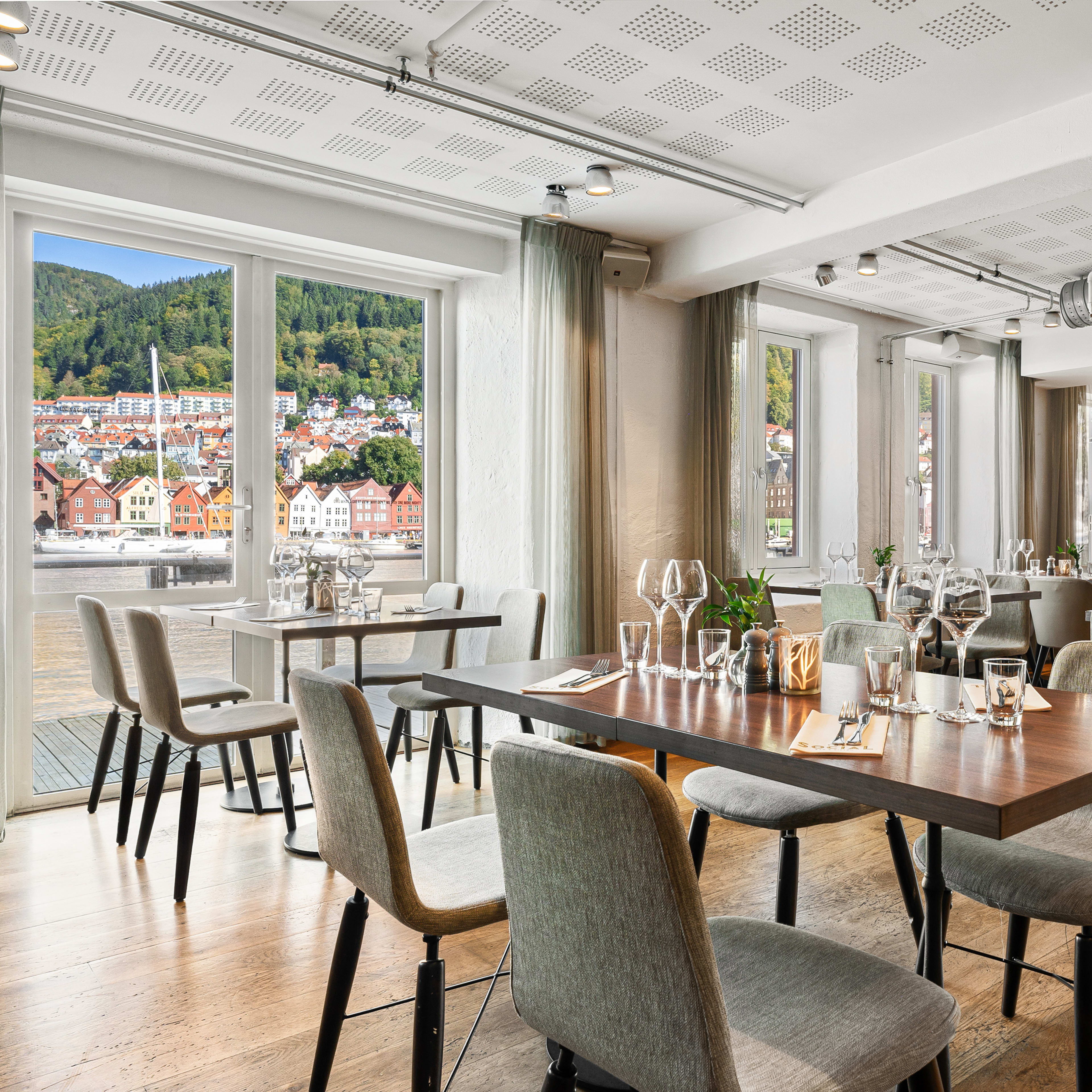 Clarion Hotel Admiral restaurant with harbor view and classic furniture overlooking UNESCO Bryggen in Bergen