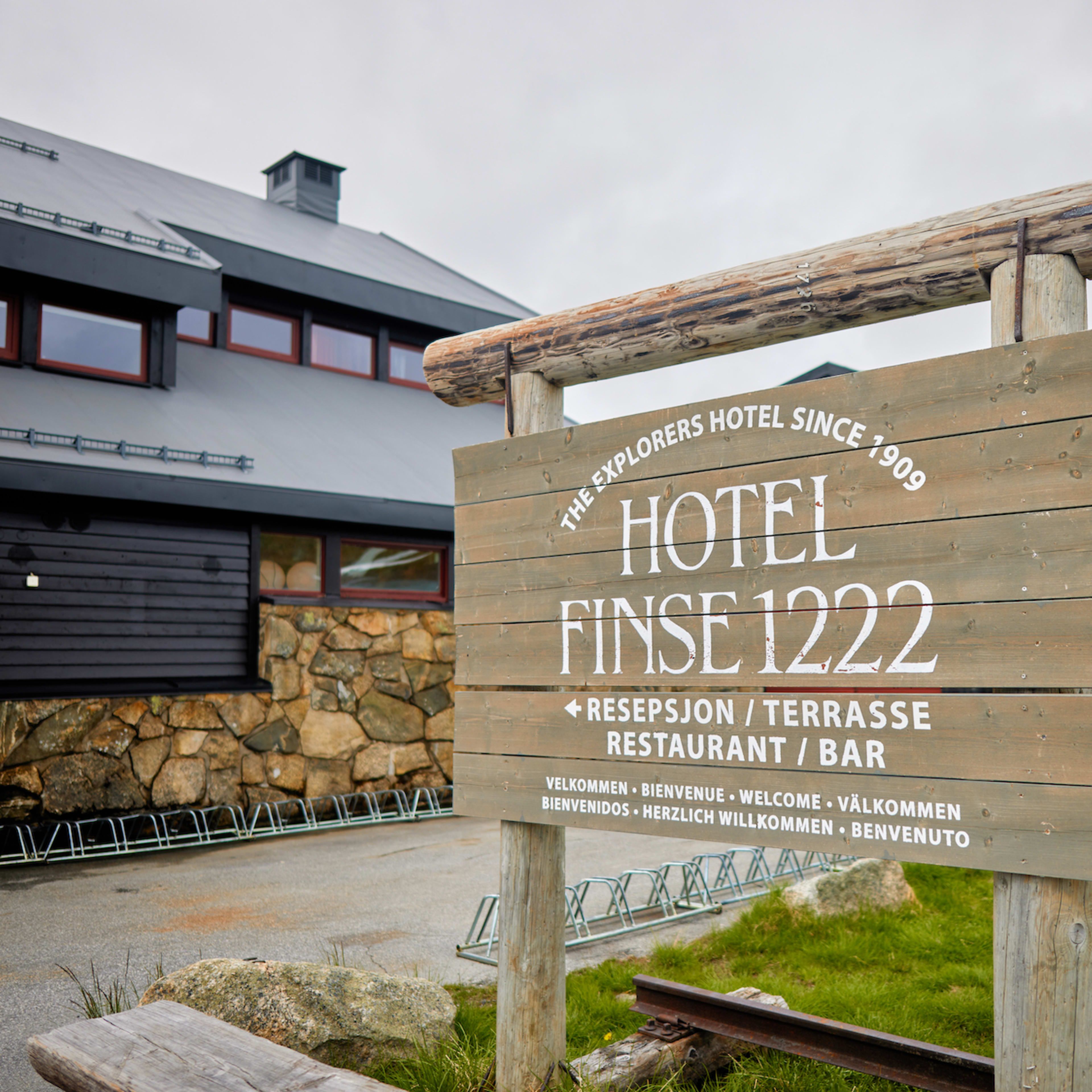 Classic wooden hotel sign at Hotel Finse 1222 entrance near Bergen Railway station with glacier views