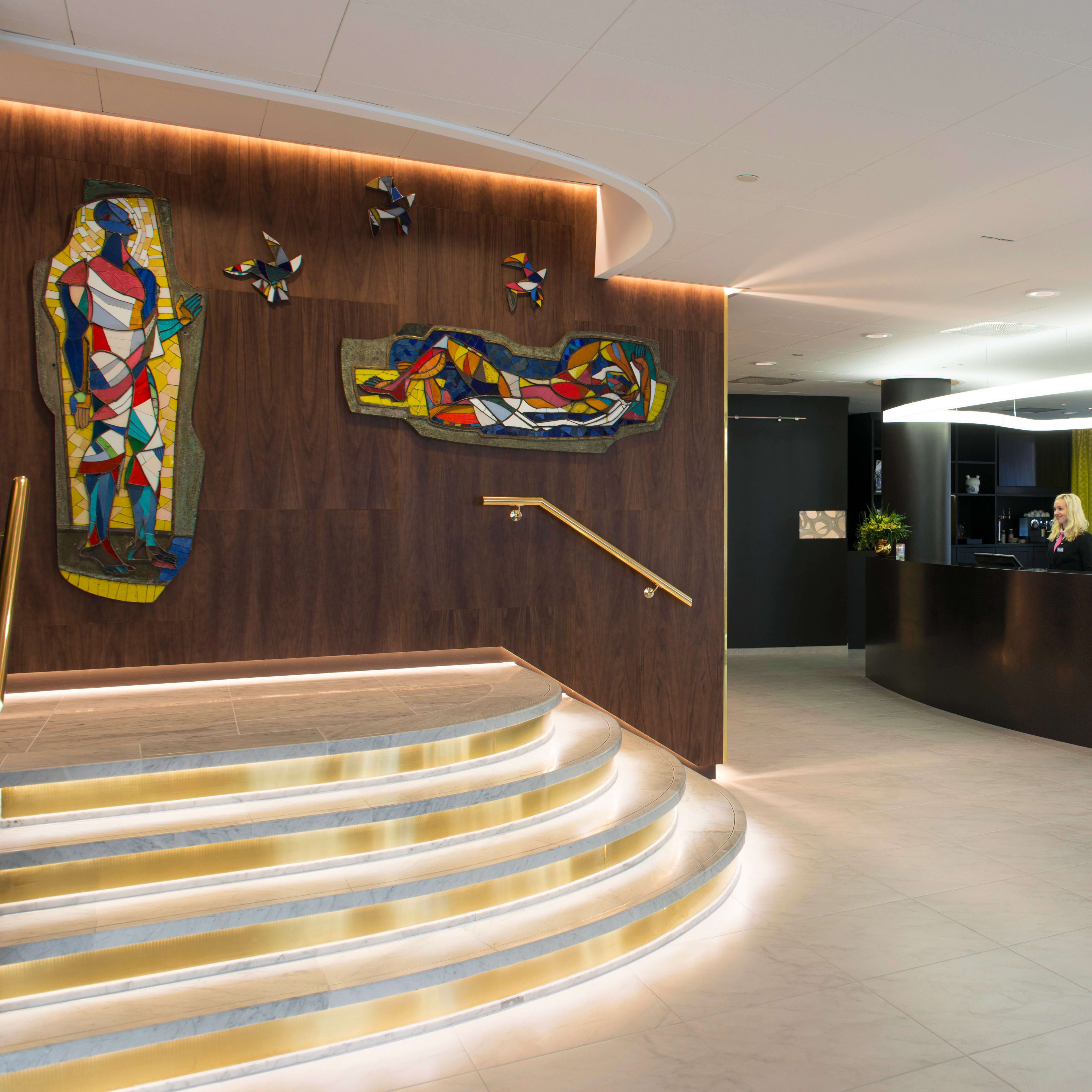 Thon Hotel Rosenkrantz Oslo reception lobby with modern stylish interior design and colorful artwork on walls