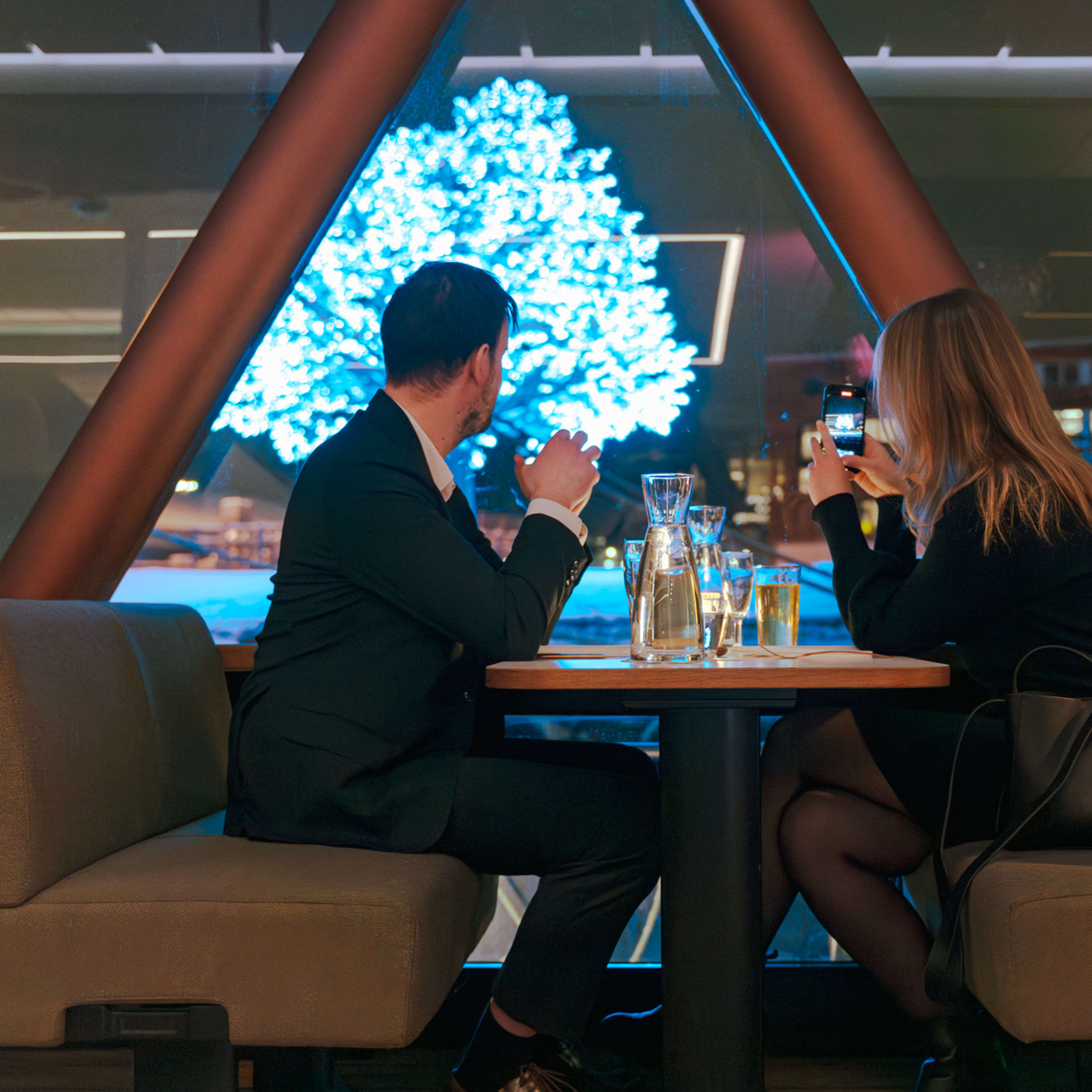 Couple enjoying drinks in elegant boat lounge