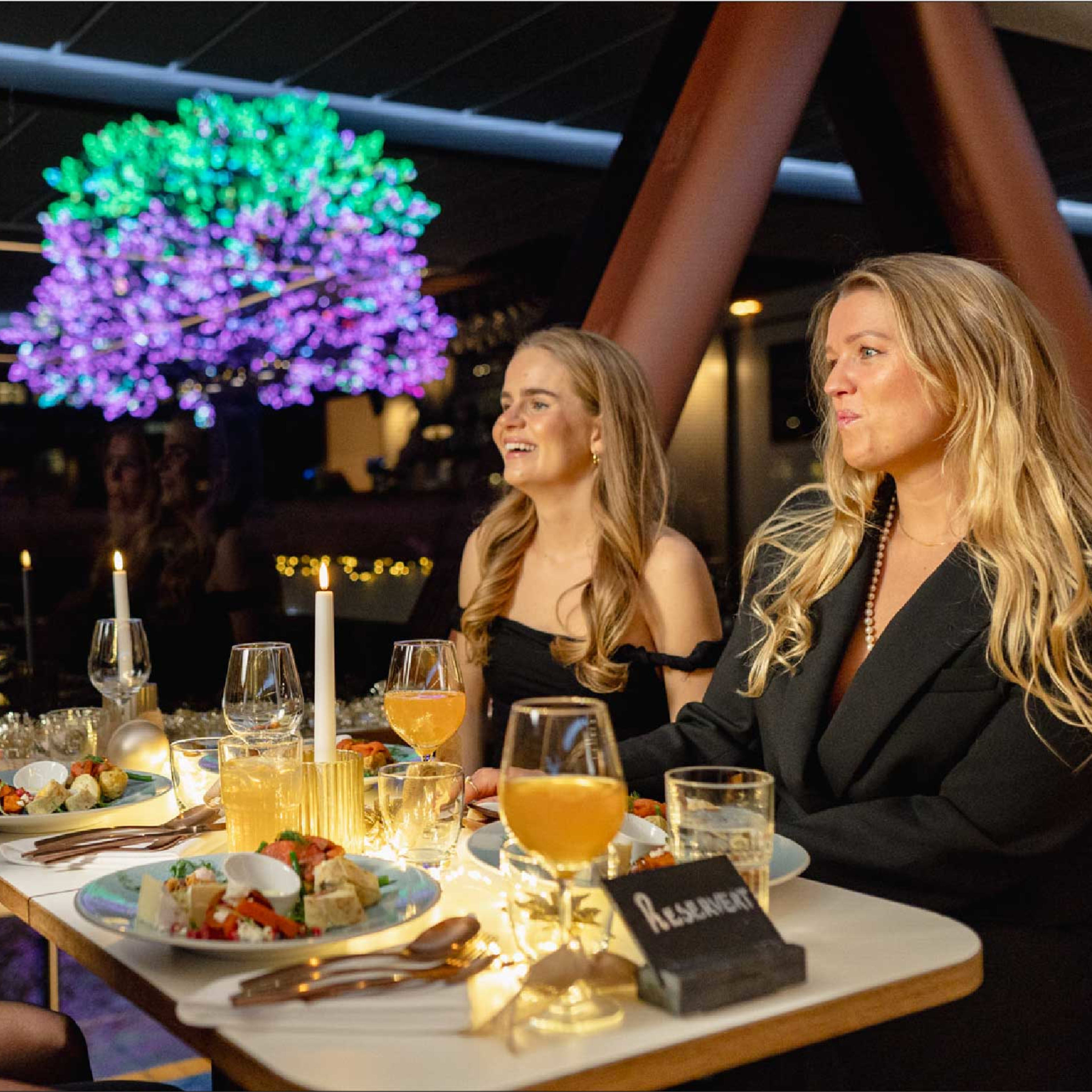 Elegant table setting with wine and food aboard cruise boat