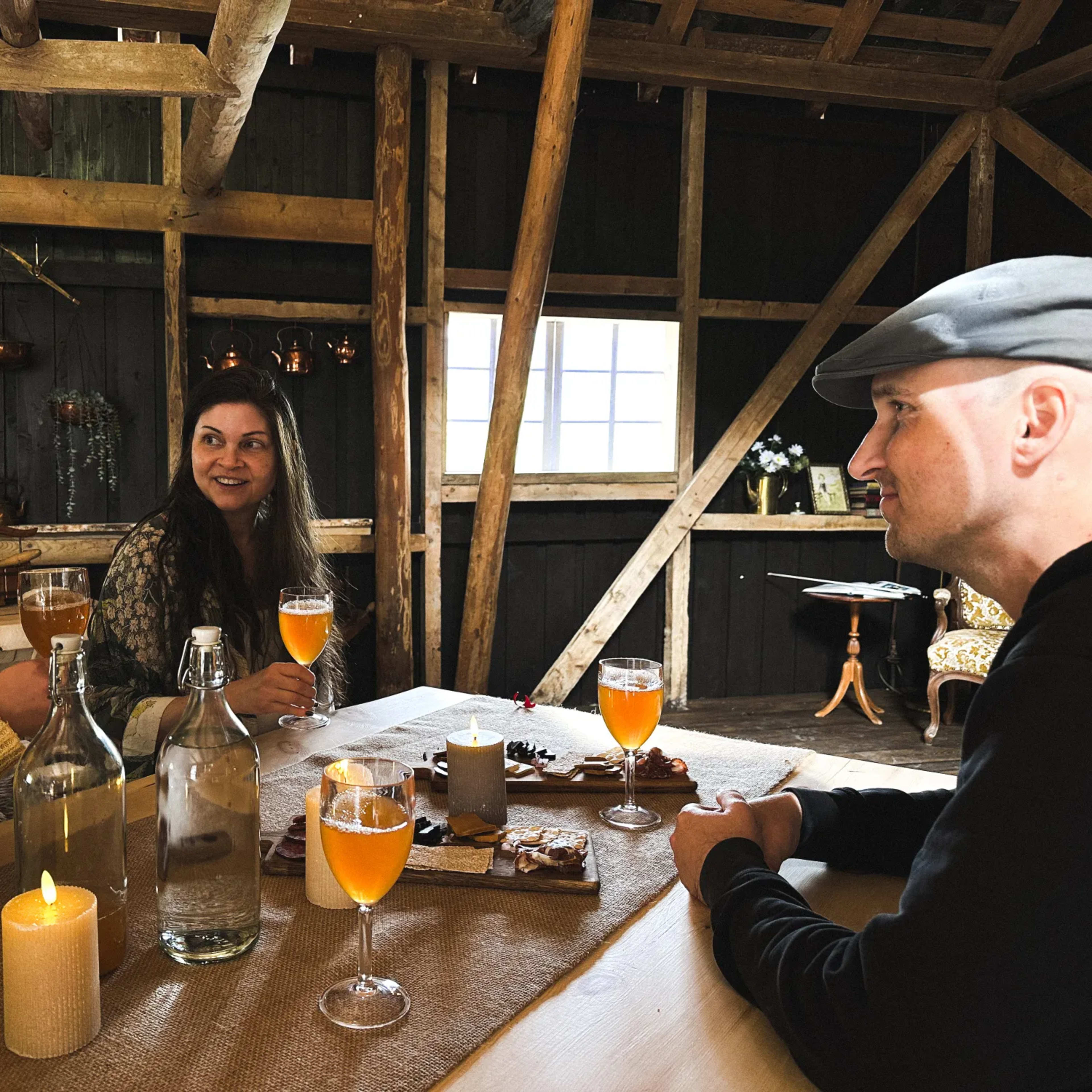 Cozy rustic barn interior lunch space at Flåm fjord farm